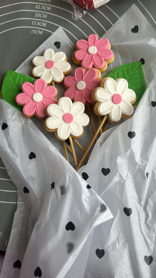 bouquet de biscuits décorés en forme de marguerites pastel